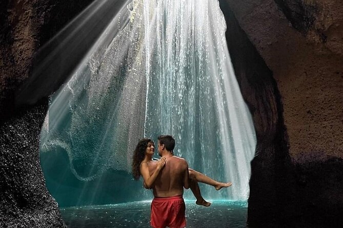 Ubud private tours - Tukad Cepung Waterfall: cave entrance power and sunbeams